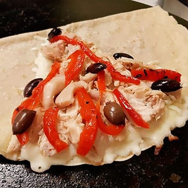 Savory Crepery crepe filled with chicken, melted cheese, red peppers, and black olives.